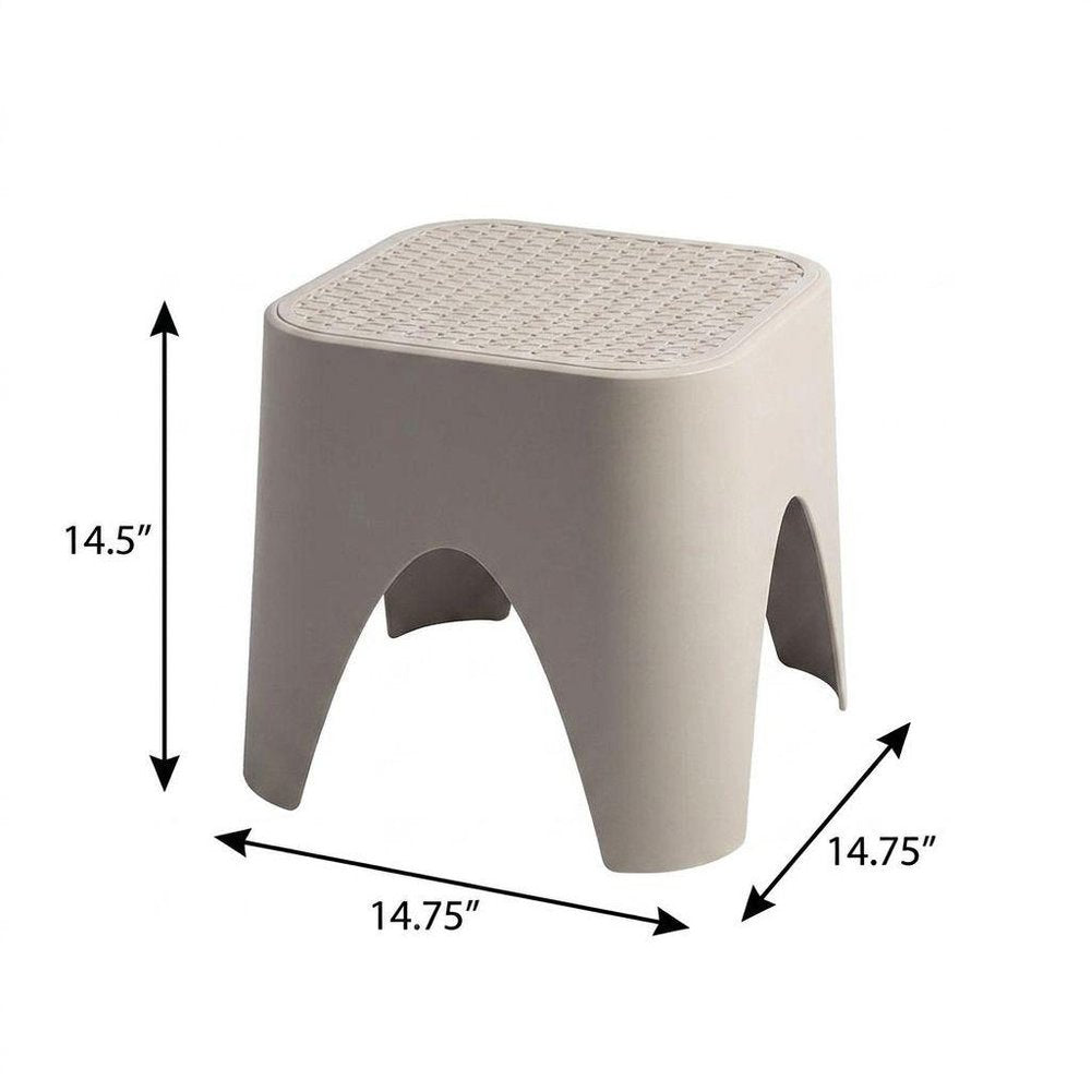 15" Plastic Outdoor Footstool Ottoman. Outdoor ottoman isolated on a plain white background, showing a plastic surface.