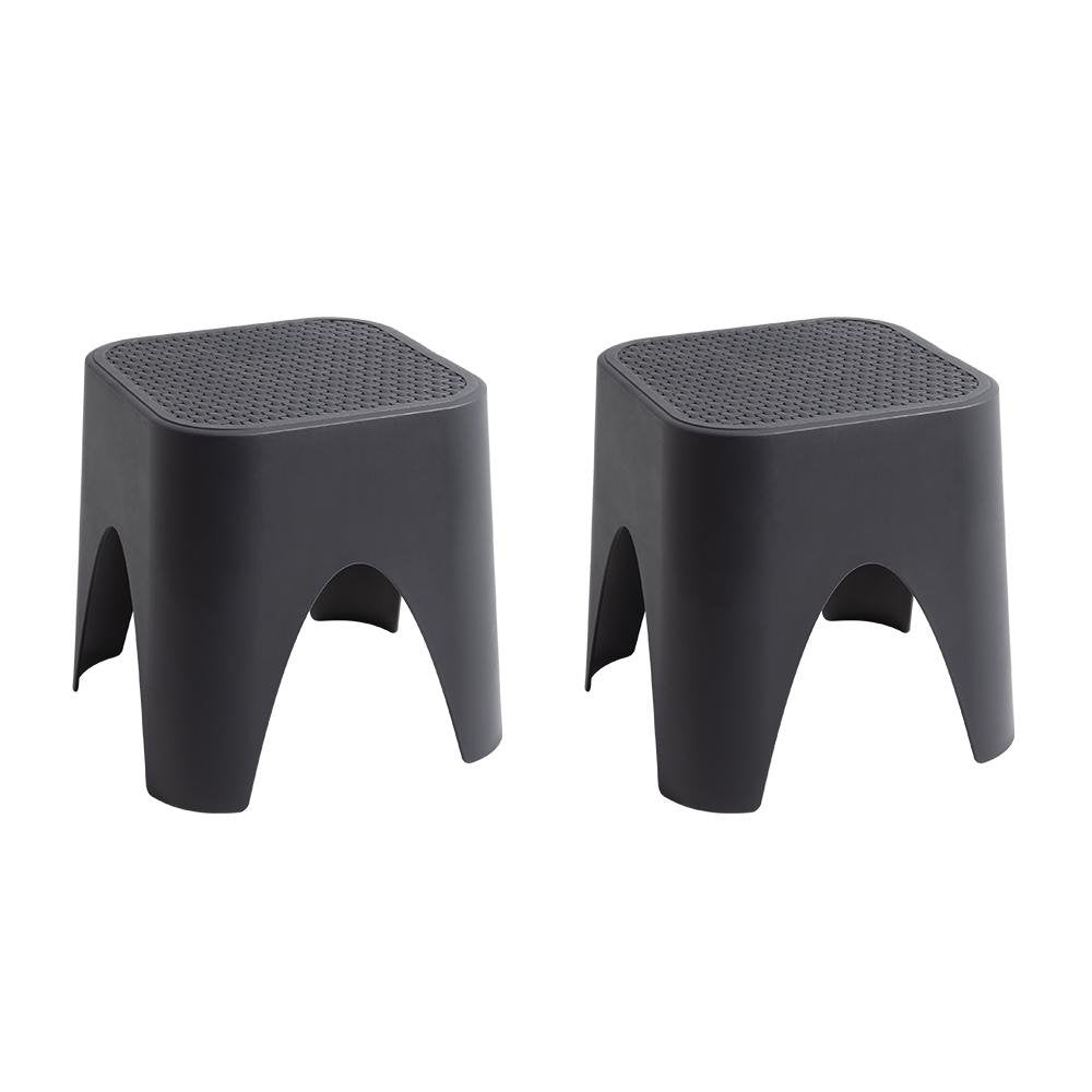 15" Plastic Outdoor Footstool Ottoman. Outdoor ottoman isolated on a plain white background, showing a plastic surface.