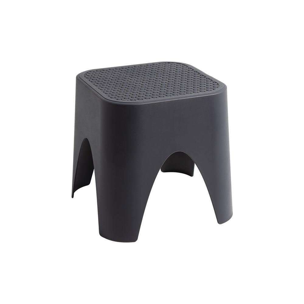 15" Plastic Outdoor Footstool Ottoman. Outdoor ottoman isolated on a plain white background, showing a plastic surface.