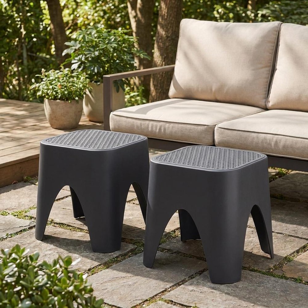 15" Plastic Outdoor Footstool Ottoman styled in a furnished interior with a olive wall on a wood floor in green plastic.