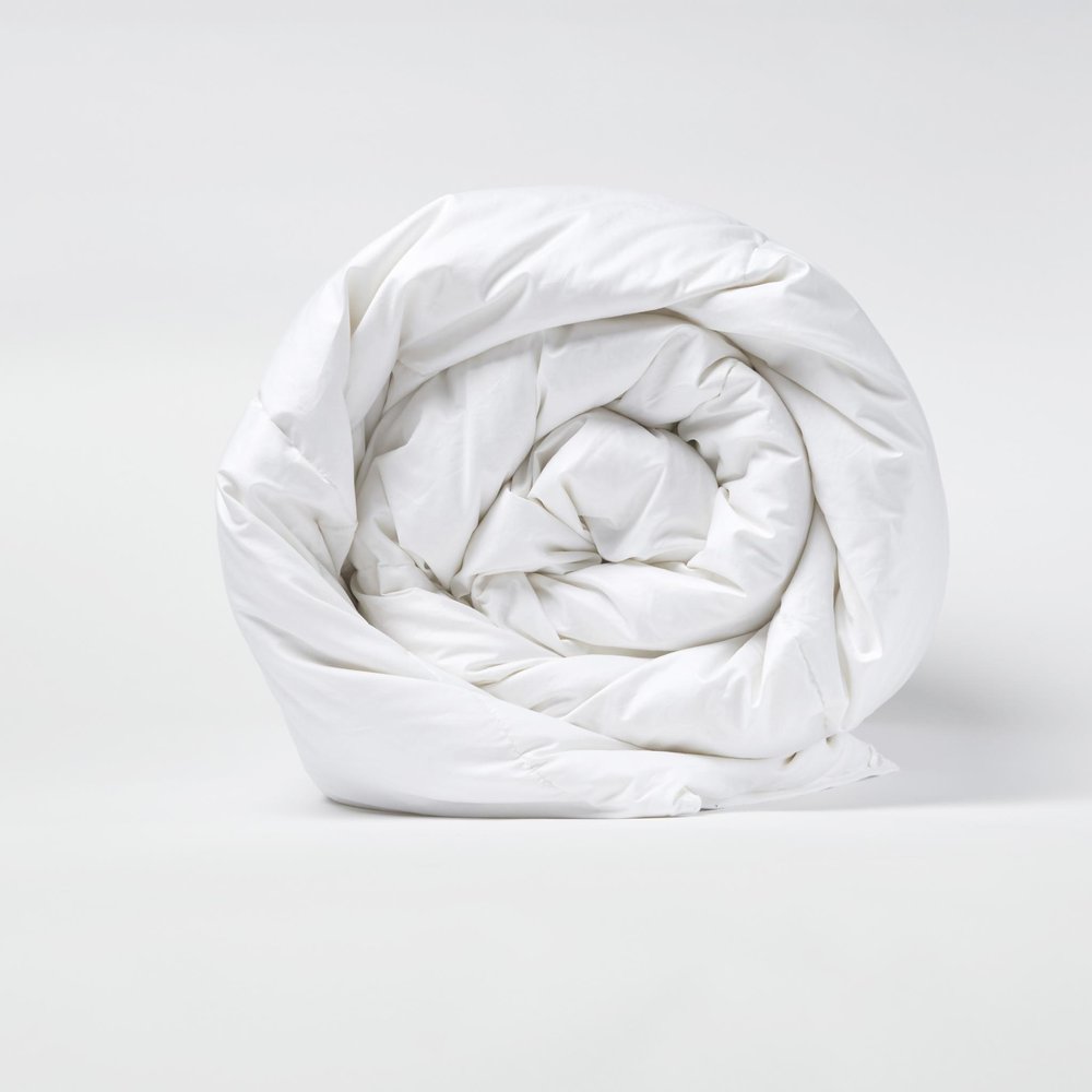 Rolled white queen comforter made of microfiber with a down alternative filling, shown on a white background.