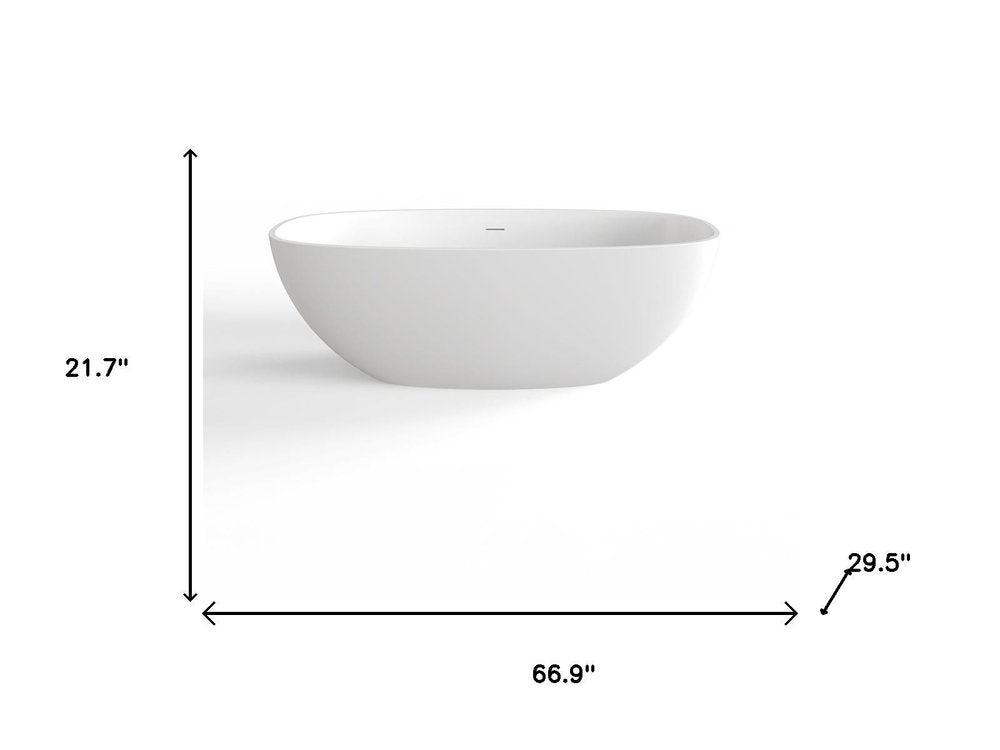 67" White Acrylic Oval Bath Tub. Bathtub isolated on a plain white background, showing its white color.
