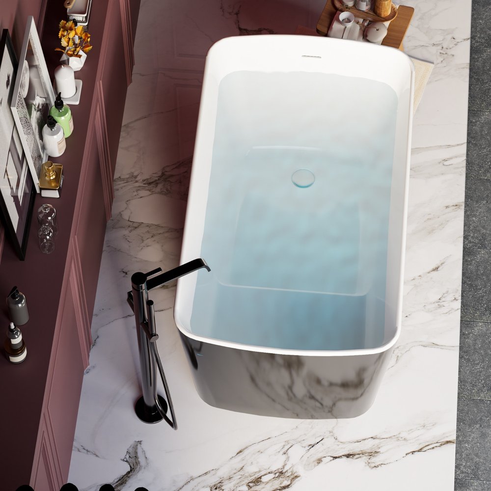 Freestanding white acrylic bathtub with black exterior on a marble floor with a chrome faucet.