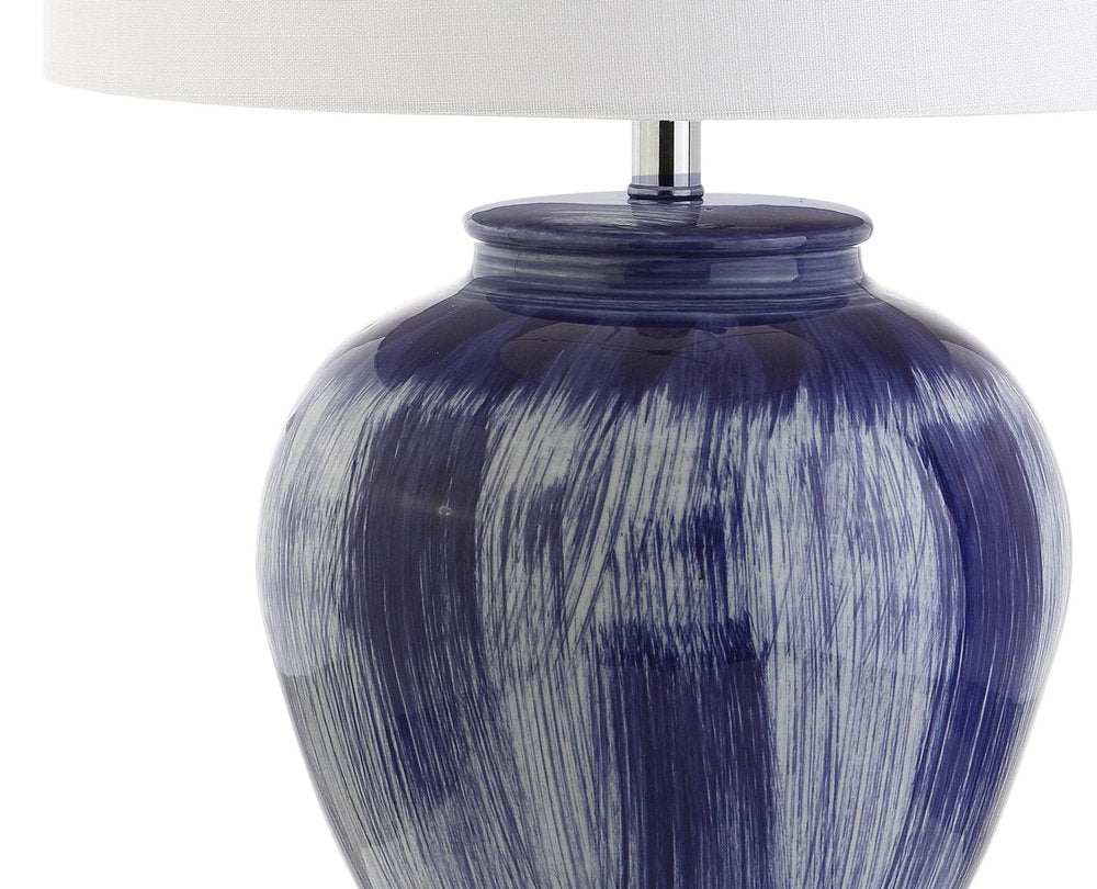 26" Blue And Clear Urn Table Lamp With Drum Shade. Table lamp isolated on a plain white background, in a blue finish.