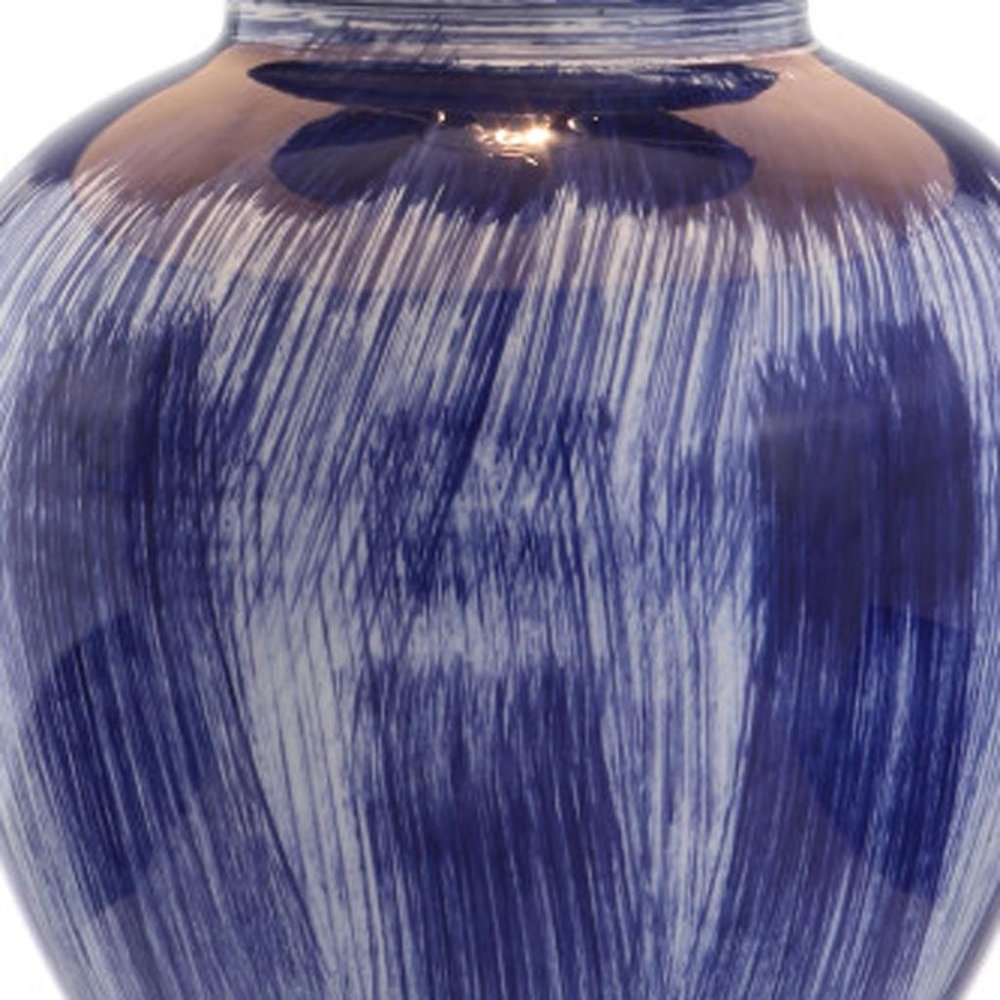Close-up of 26" Blue And Clear Urn Table Lamp With Drum Shade showing blue detail.