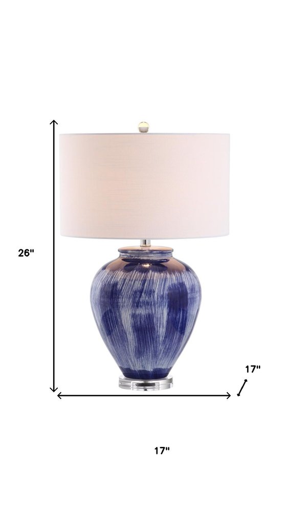 26" Blue And Clear Urn Table Lamp With Drum Shade. Table lamp isolated on a plain white background, finished in blue.