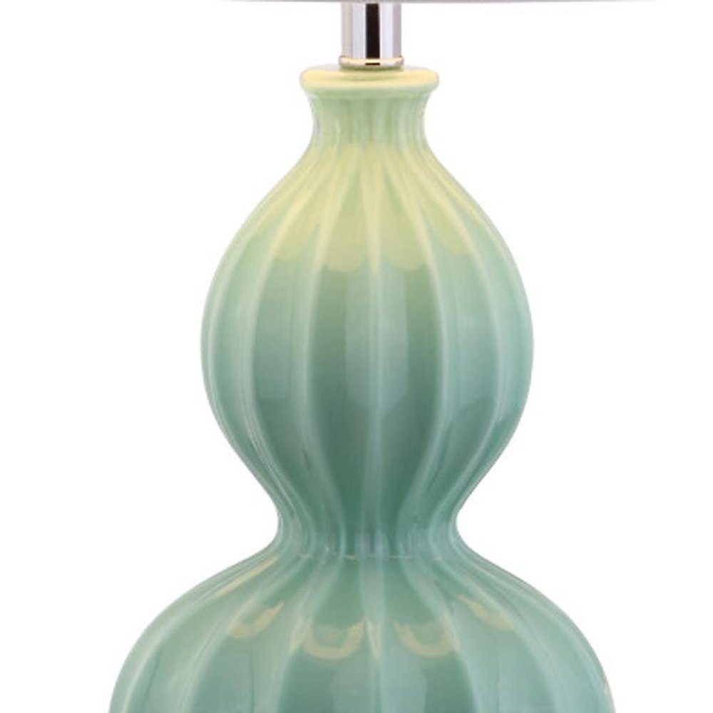 28" Clear Novelty Table Lamp With Drum Shade. Table lamp isolated on a plain white background.