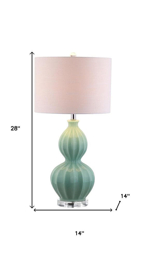 28" Clear Novelty Table Lamp With Drum Shade. Table lamp isolated on a plain white background.