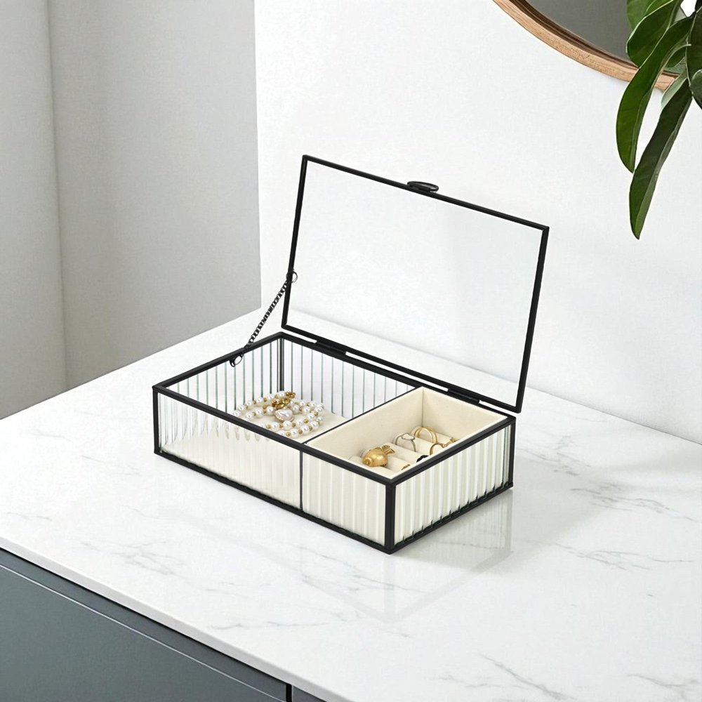 10" Black Glass Two Section Jewelry Box With Metal Accents. Jewelry boxe isolated on a plain white background, showing a glass surface.