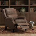 36" Brown Faux Leather Manual Recliner styled in a furnished interior with a dark brown wall on a dark wood floor.