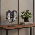 13" Gray Glass Crystal styled in a furnished interior with a tan wall on a dark wood floor.