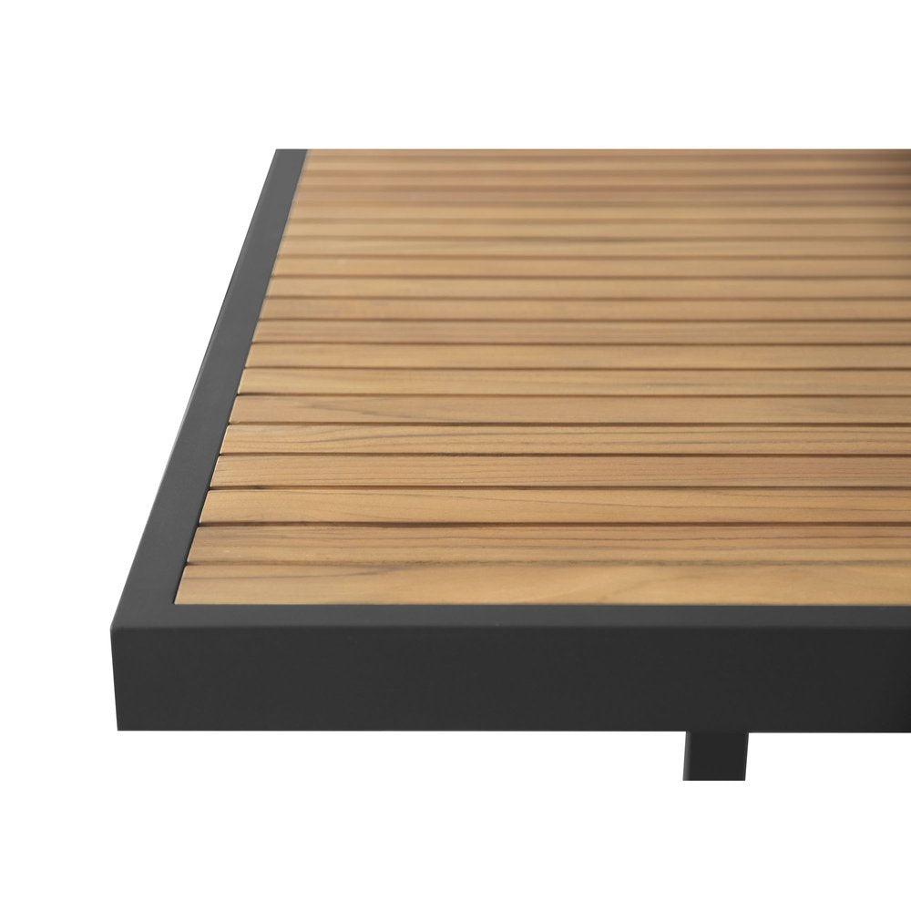 Close-up of a slatted wood tabletop with a black metal frame on a white background.