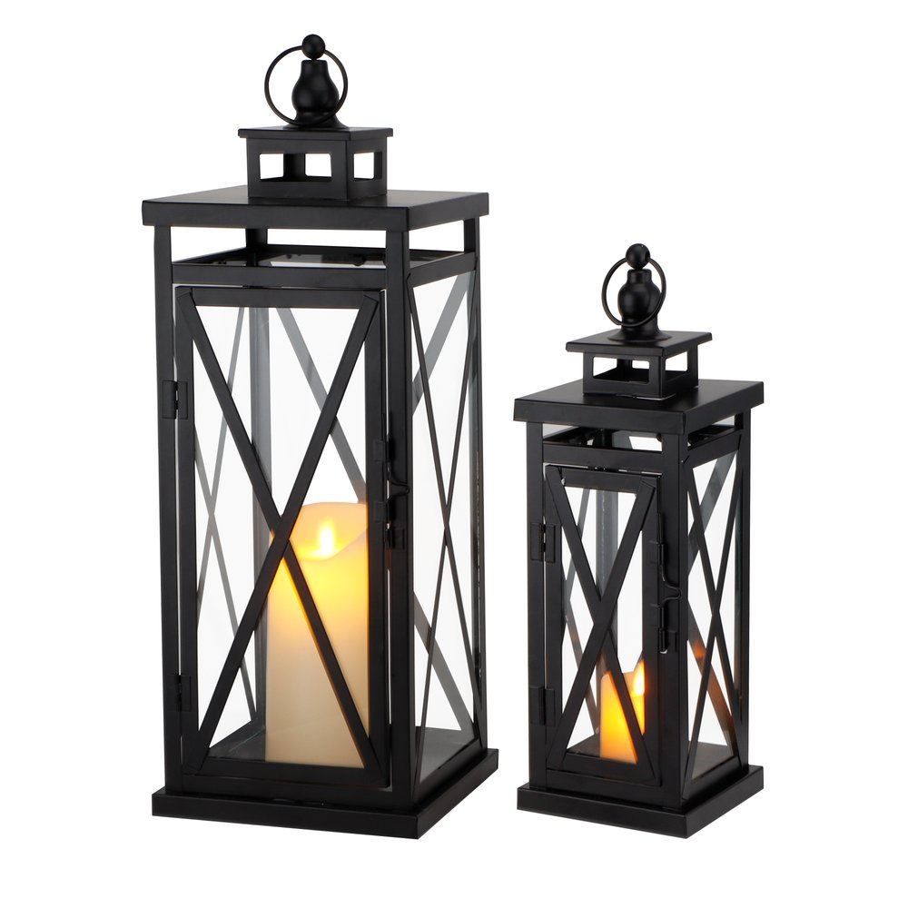 Two black metal and glass tabletop lanterns with candles inside, displayed on a white background.