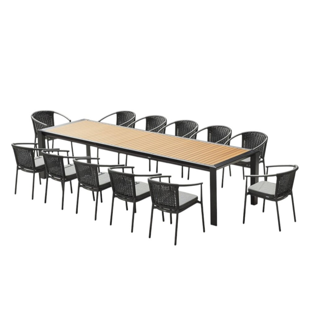 A 13-piece dining set with a natural wood tabletop and black frame, including a long table and twelve black chairs with grey cushions, on a white background.