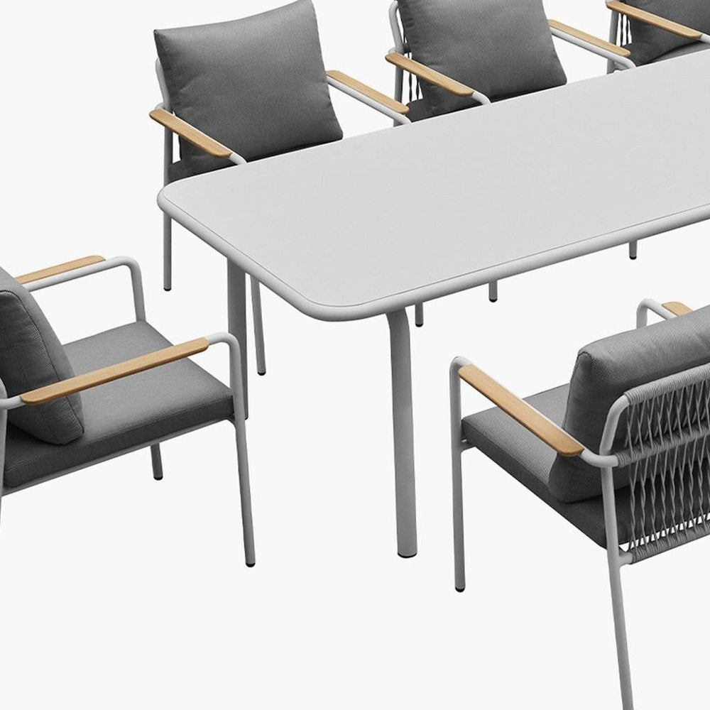 Nine Piece White Metal Dining Set with Eight Chairs on a white background