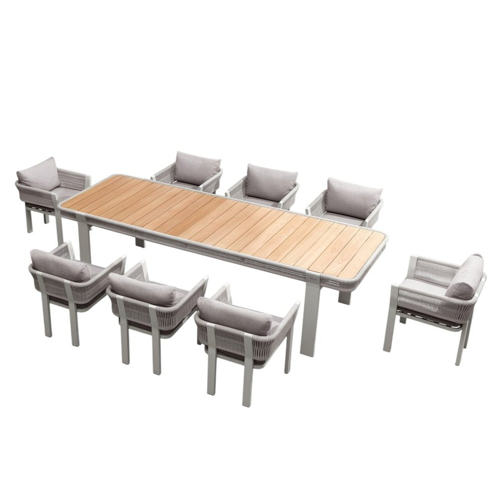 Nine Piece Light Brown and Beige Solid Wood Dining Set with Eight Chairs on a white background