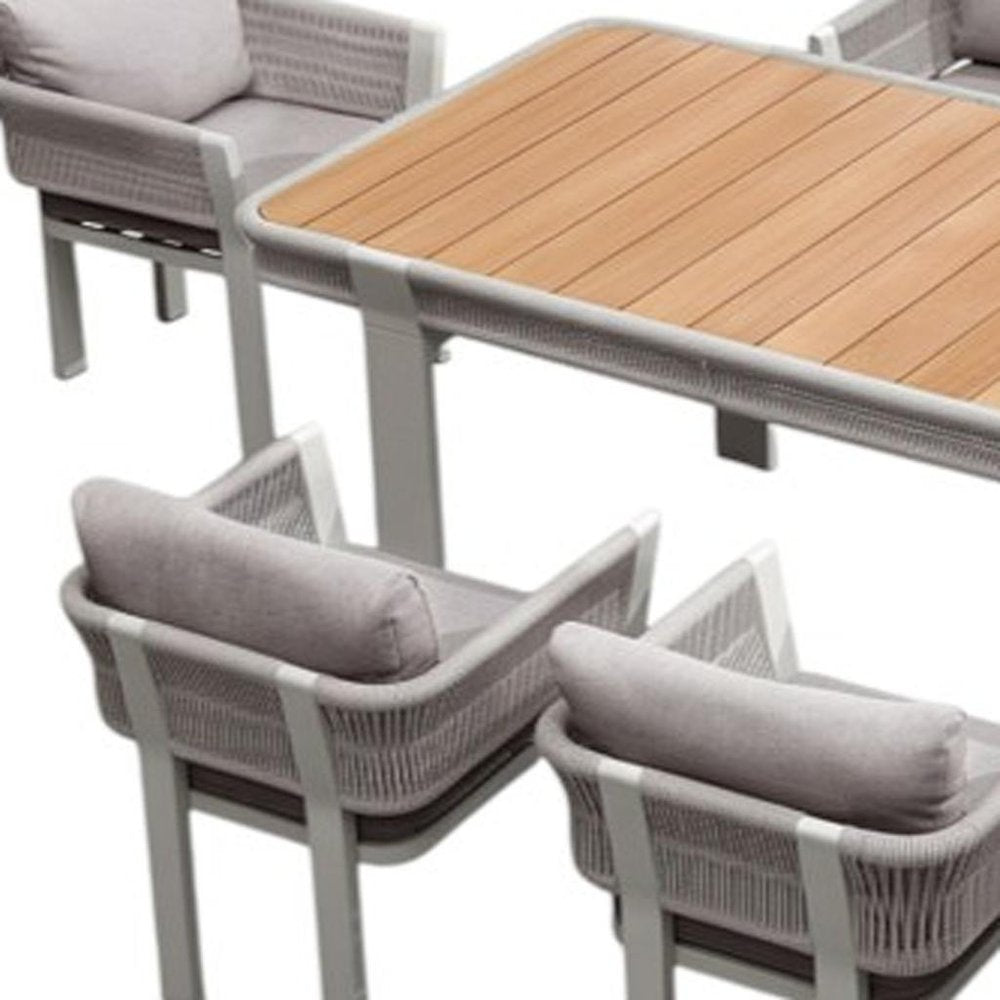 Nine Piece Light Brown and Beige Solid Wood Dining Set with Eight Chairs on a white background