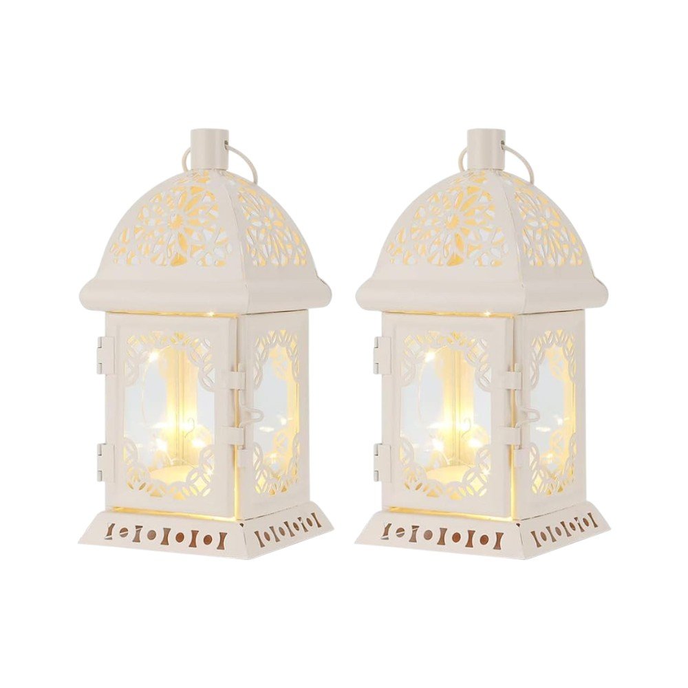 Two white metal and glass pierced scrollwork lantern lamps with LED lights on a white background.