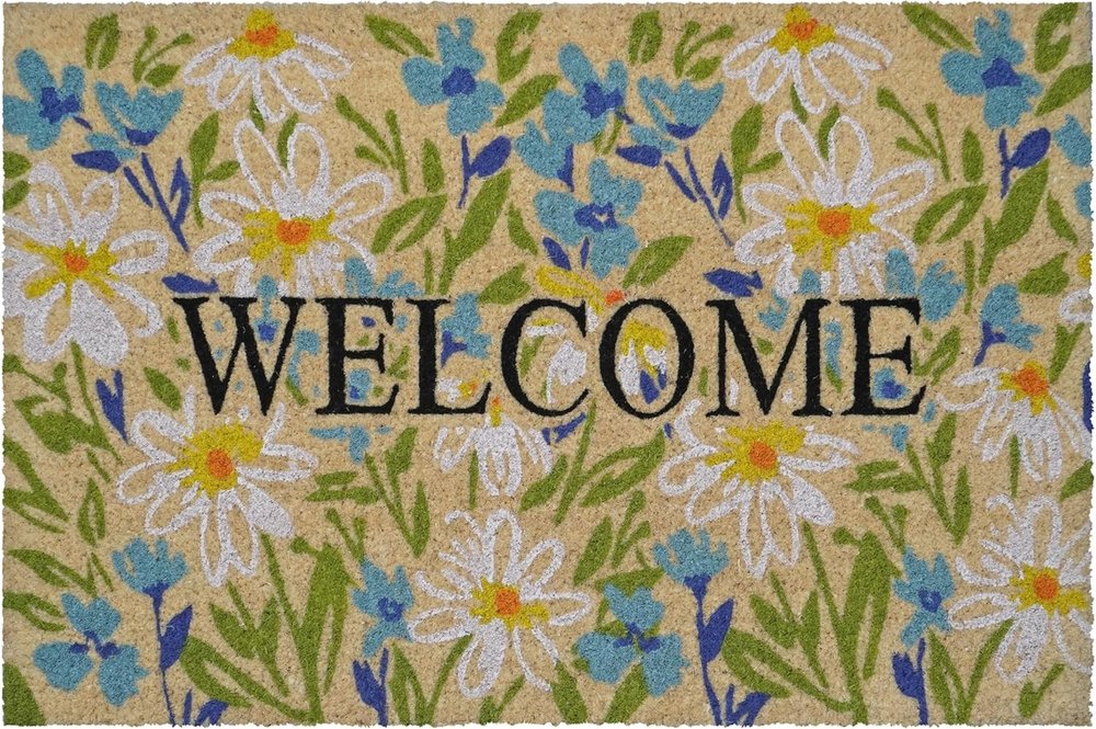 Welcome doormat with a floral pattern in brown, light blue, and green.