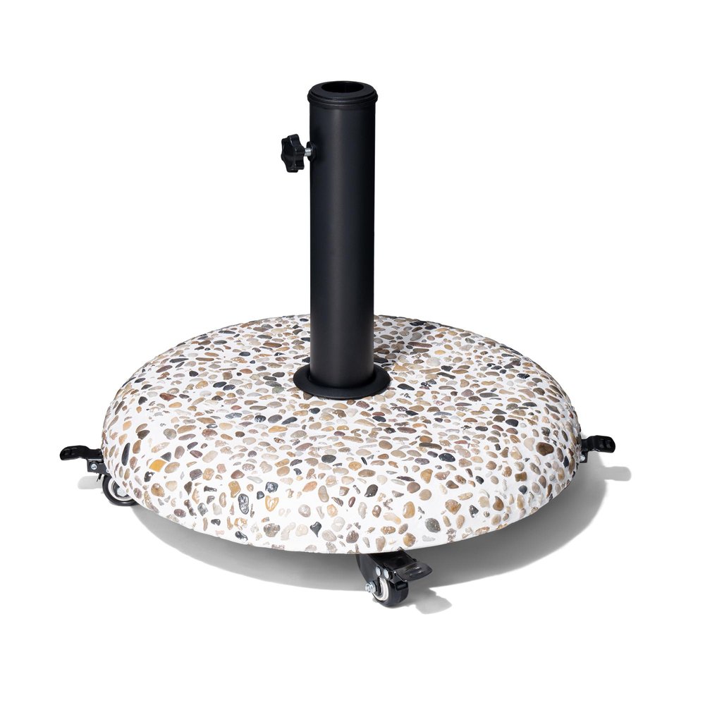 Round umbrella base with a speckled stone finish and black steel pole, featuring four wheels on a white background.