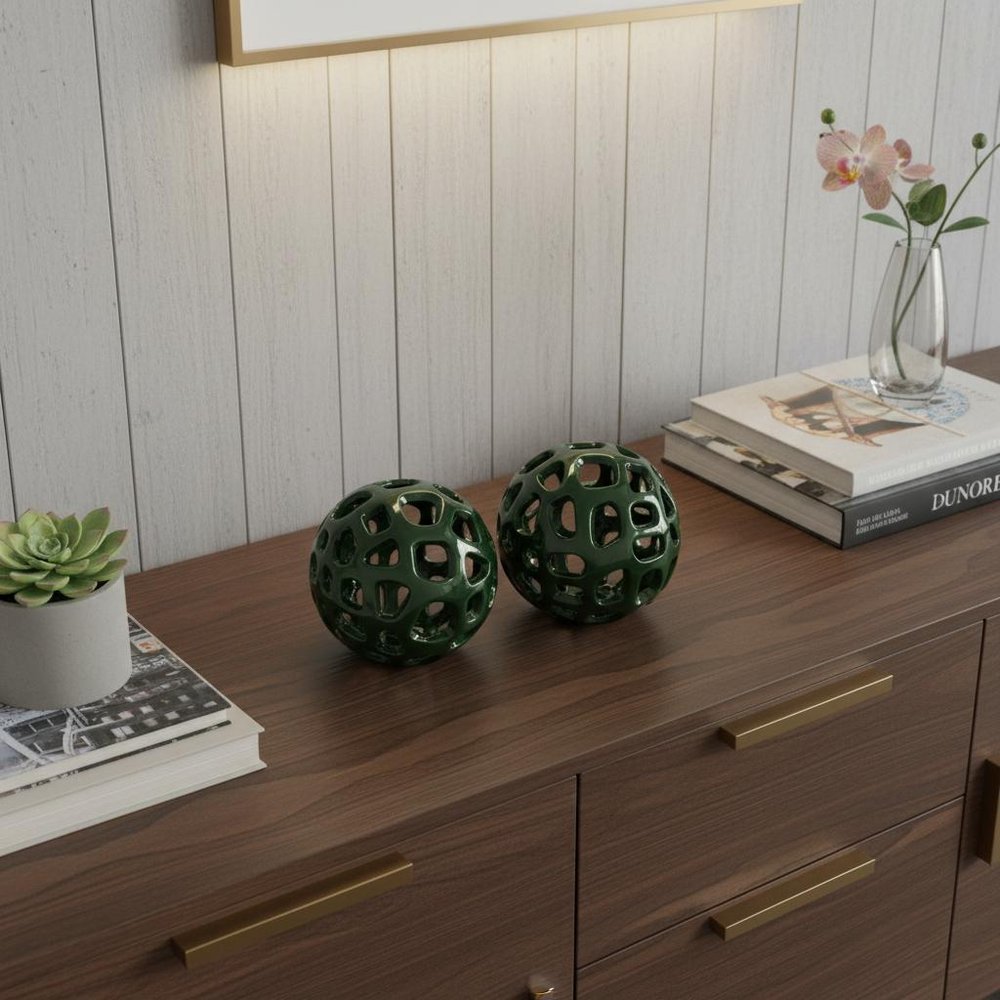 Set of Two Green Aluminum Hand Painted Decorative Orbs in a home interior