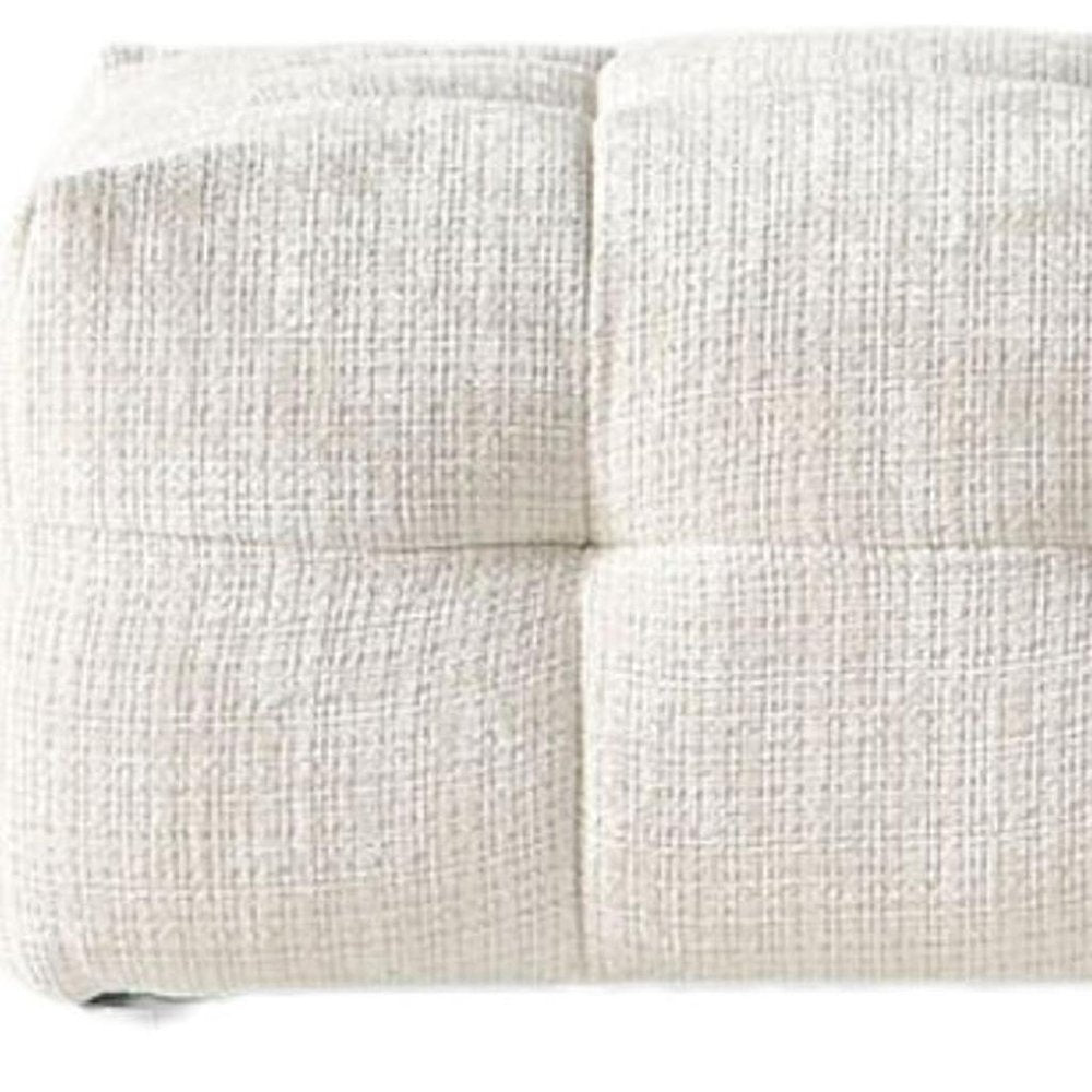36" Beige and Black Chenille Tufted Pouf Ottoman. Ottoman isolated on a plain white background, finished in beige.