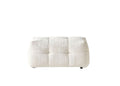 A beige chenille tufted pouf ottoman with black legs on a white background.