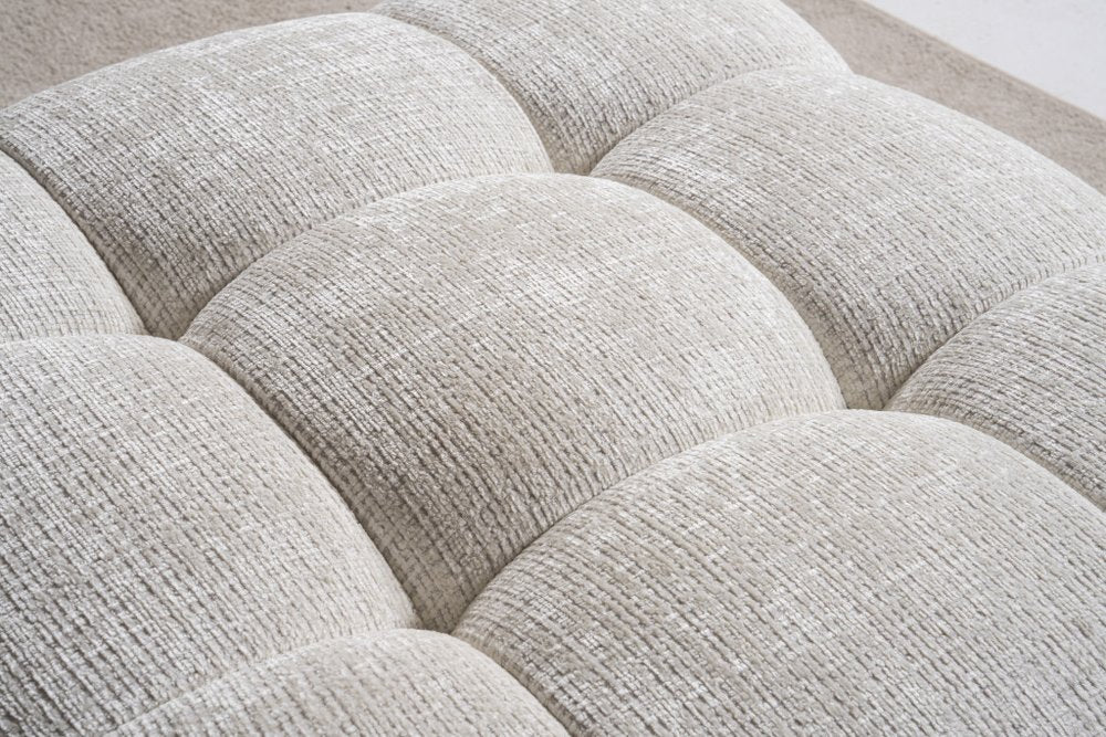 36" Beige and Black Chenille Tufted Pouf Ottoman. Ottoman isolated on a plain white background, in a beige finish.