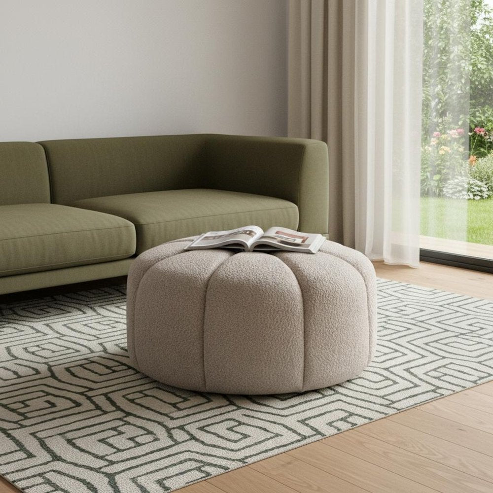 32" Taupe Tufted Boucle Tufted Round Ottoman. Ottoman in taupe.