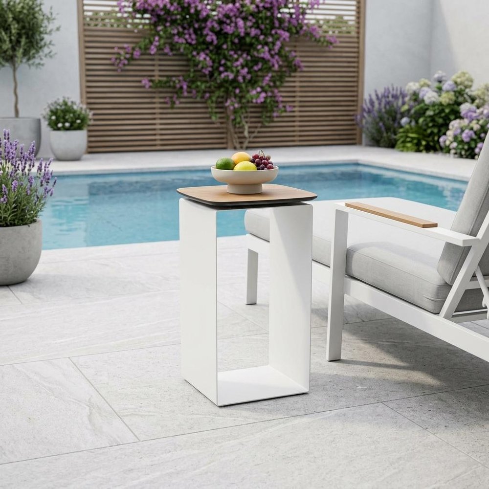 12" White And Brown Aluminum And Heavy Duty Resin Outdoor Side Table styled in a furnished interior with a light gray wall on a off-white floor.