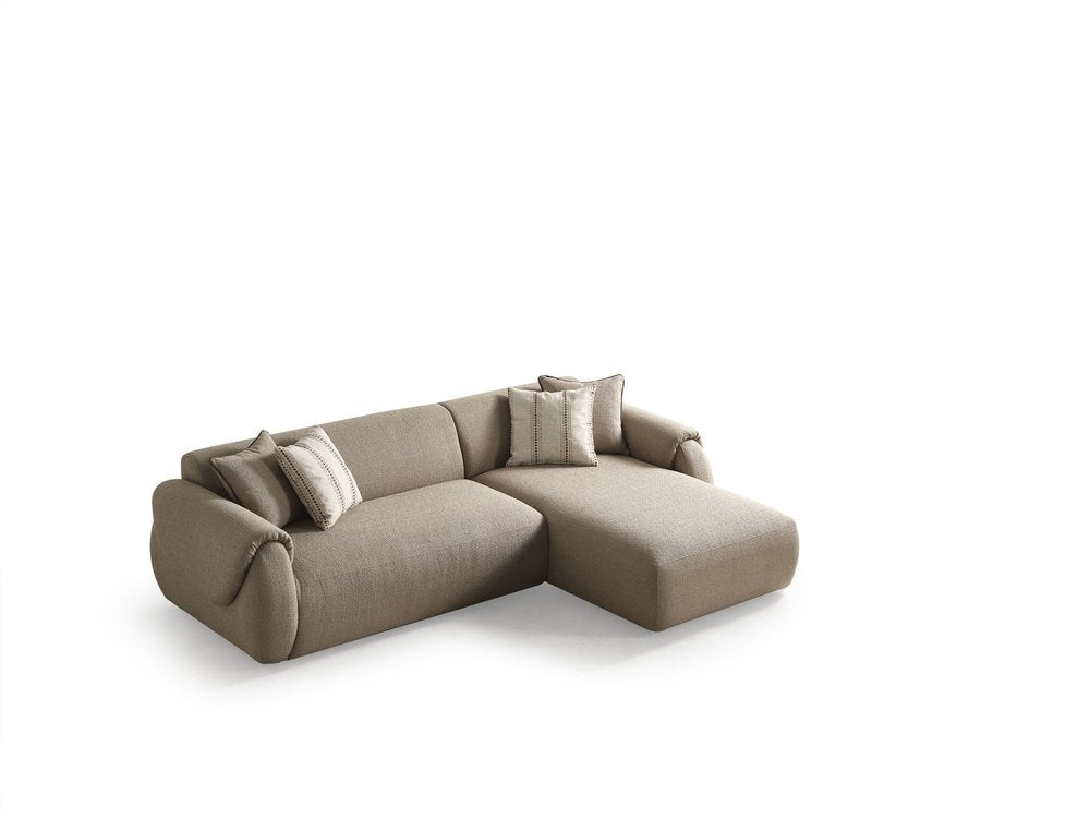 Taupe boucle L-shaped two-piece sectional sofa with chaise and toss pillows on a white background.