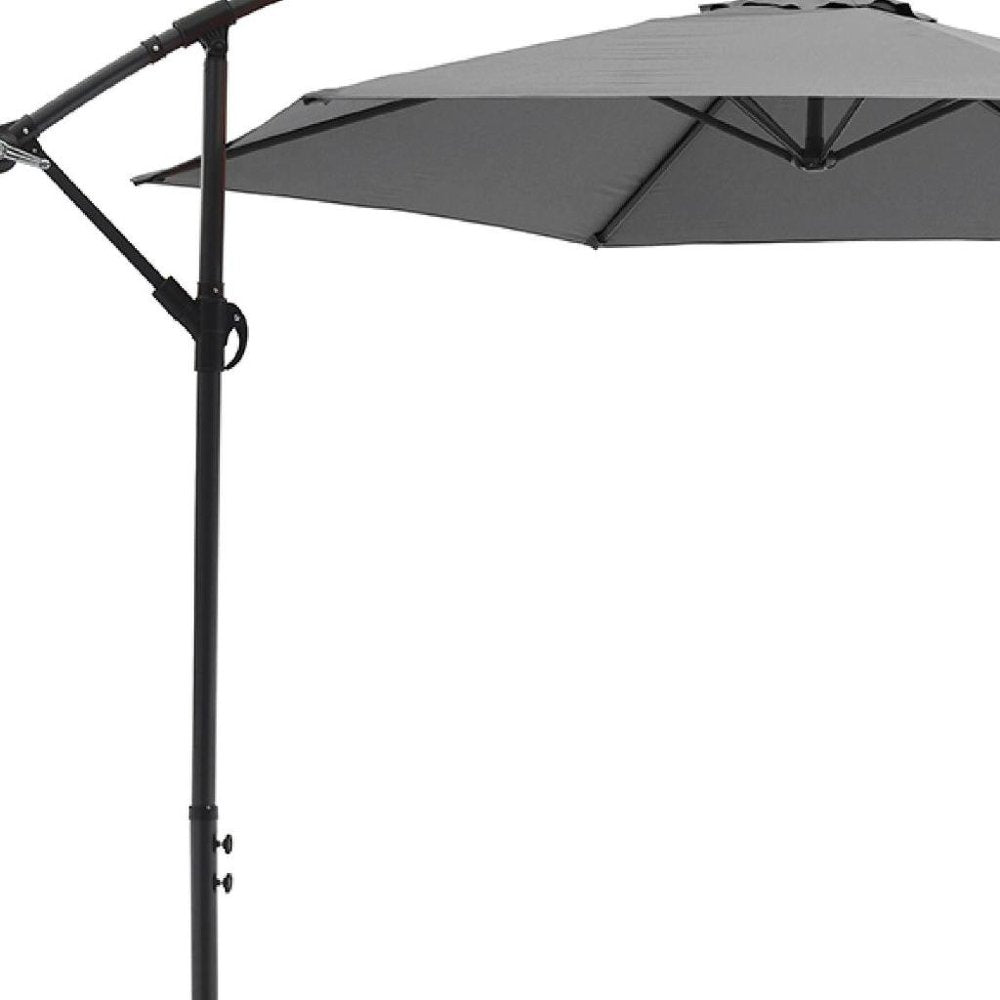 9.5' Gray Polyester Hexagonal Cantilever Patio Umbrella with Stand on a white background