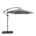 9.5' Gray Polyester Hexagonal Cantilever Patio Umbrella with Stand on a white background