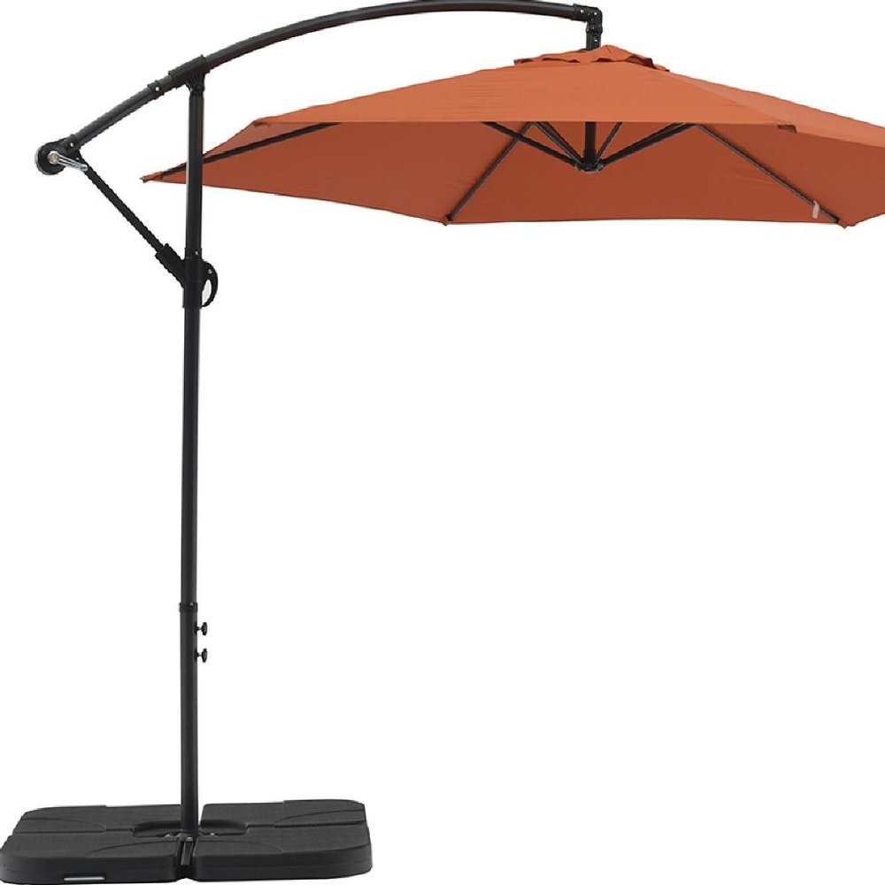 9.5' Orange Polyester Hexagonal Cantilever Patio Umbrella with Stand on a white background