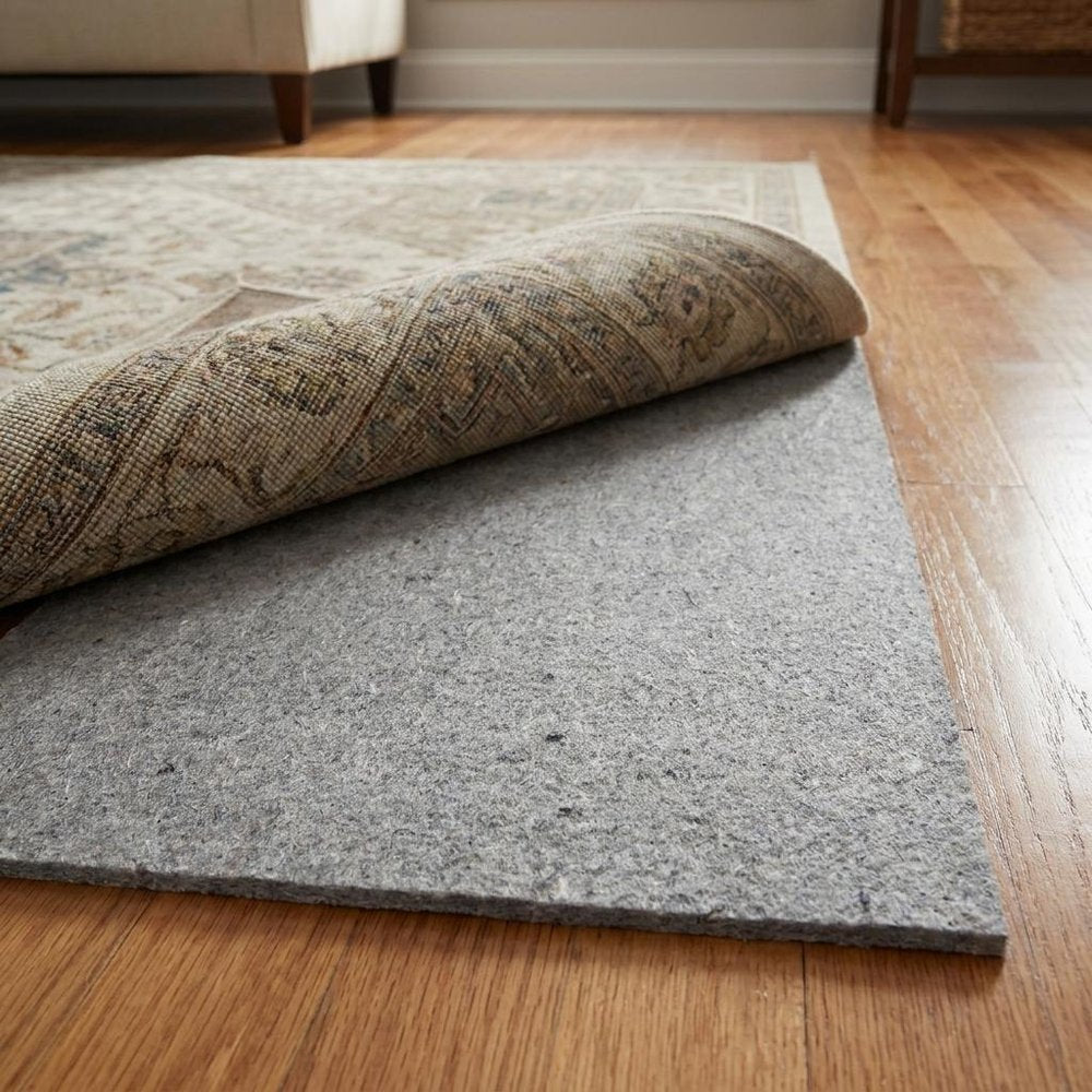 9' x 12' Gray Non Slip Rug Pad shown as a full-frame view of the gray and tan surface.