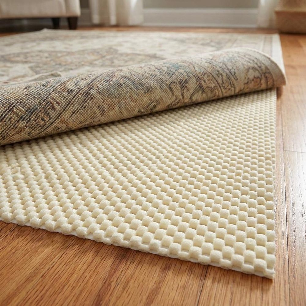 6' x 9' White Non Slip Rug Pad shown as a full-frame view of the tan and cream surface.