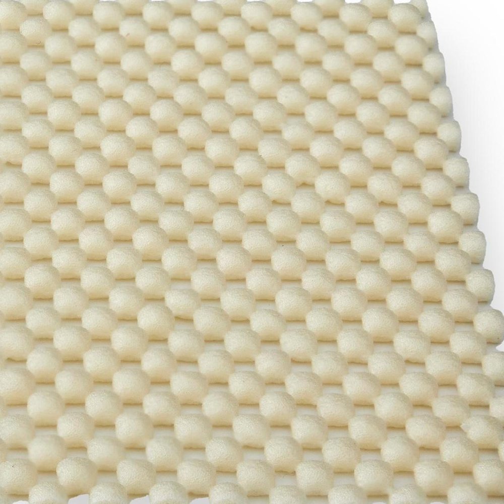 6' x 9' White Non Slip Rug Pad shown as a full-frame view of the cream and tan surface.