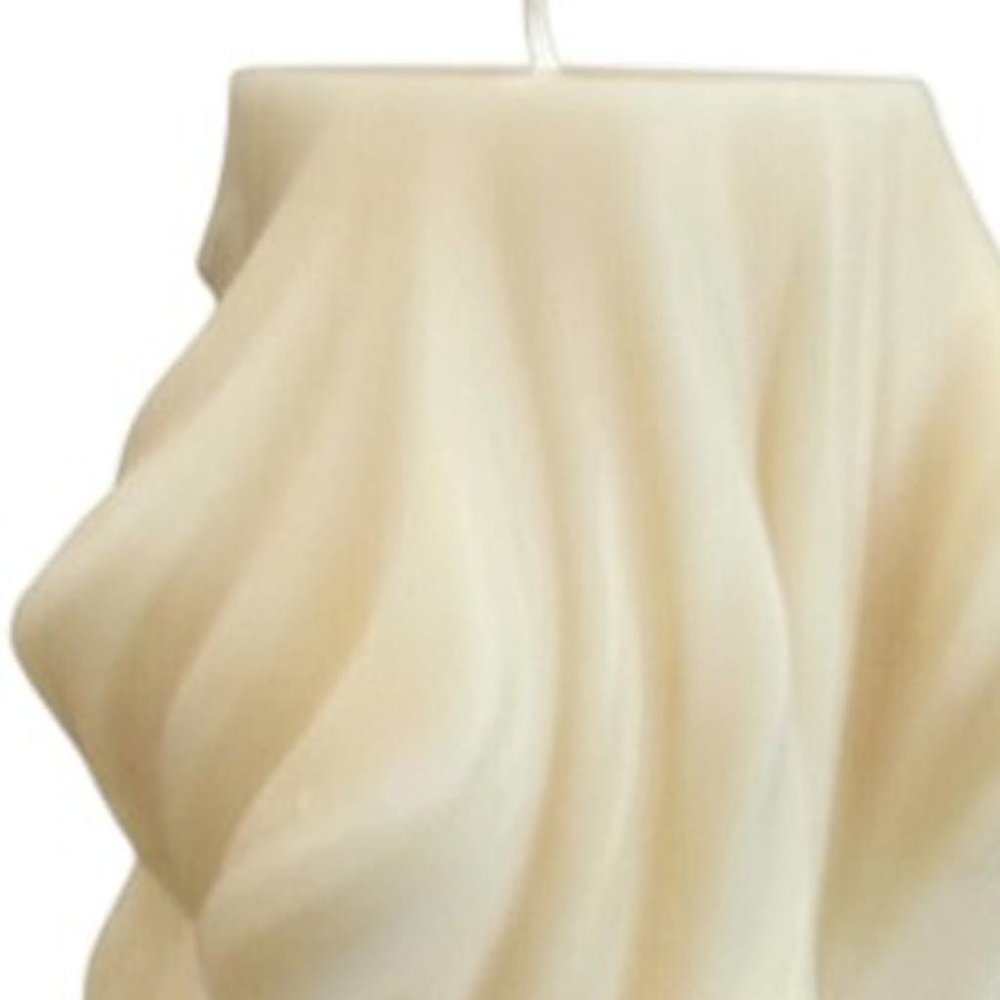 4" White Unscented Dimensional Twist Candle. Candle in white.