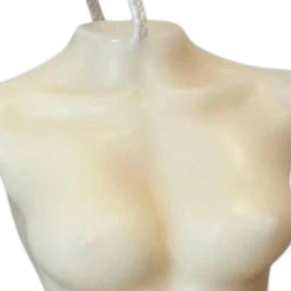 4" Ivory Black Ice Scented Dimensional Female Form Candle. Candle isolated on a plain white background, showing its ivory color.