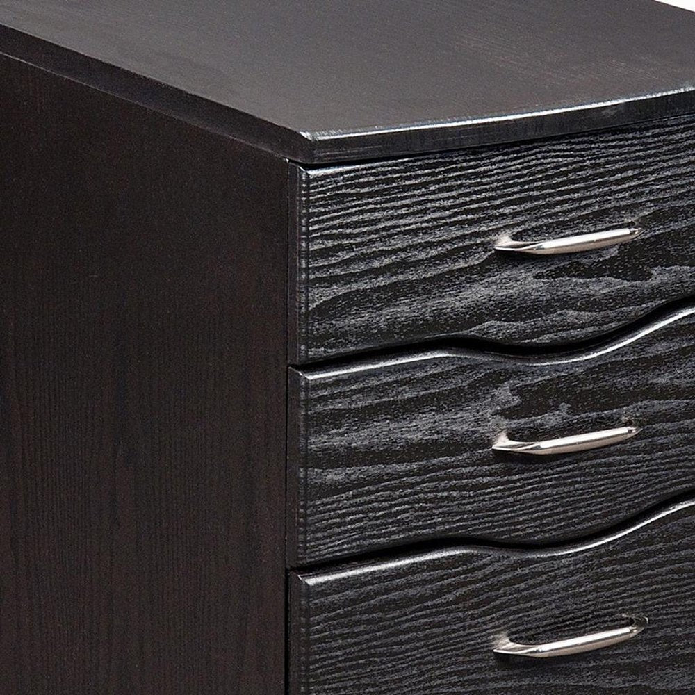 25" Espresso Wood Three Drawer Rolling Filing Cabinet photographed against a dark studio background in black.