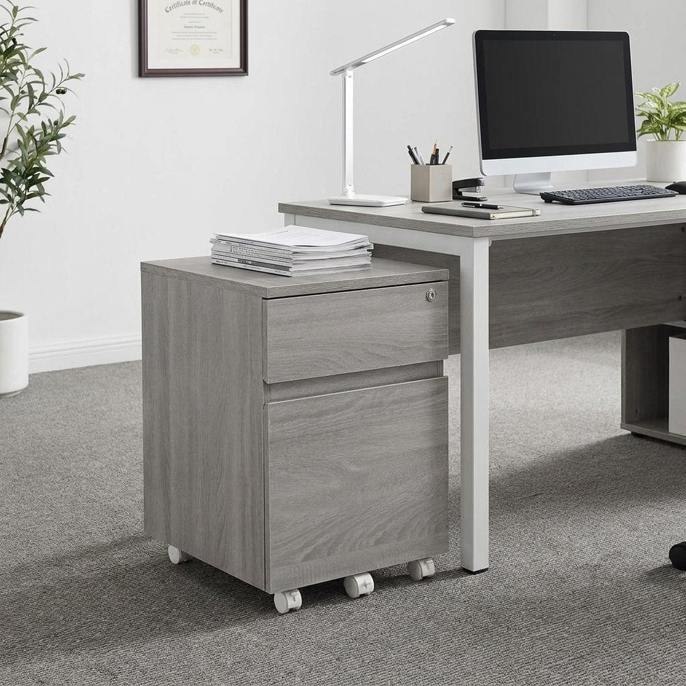 23" Gray Wood Two Drawer Rolling Filing Cabinet styled in a furnished interior with an off-white wall on a tiled floor.
