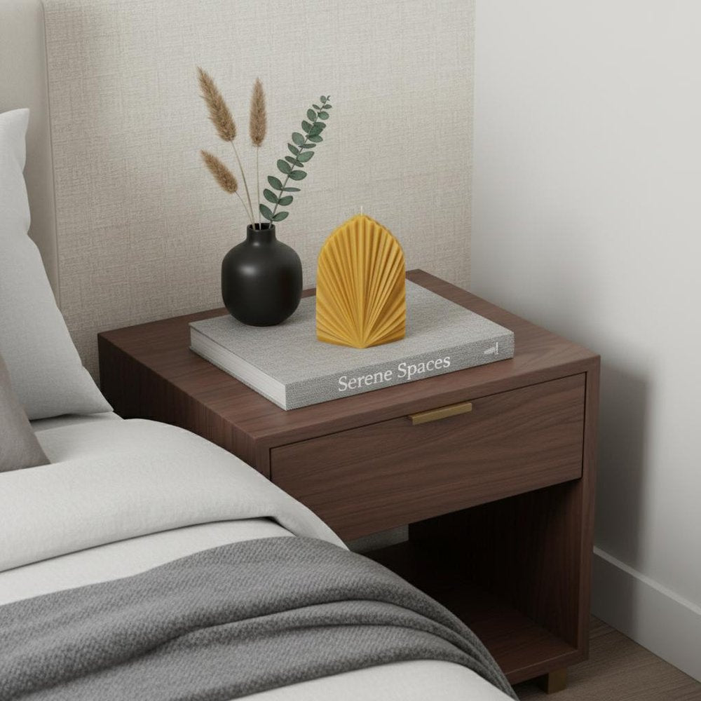 6" Gold Clean Cotton Scented Dimensional Palm Leaf Candle displayed on a tabletop in a furnished interior against a light gray wall.