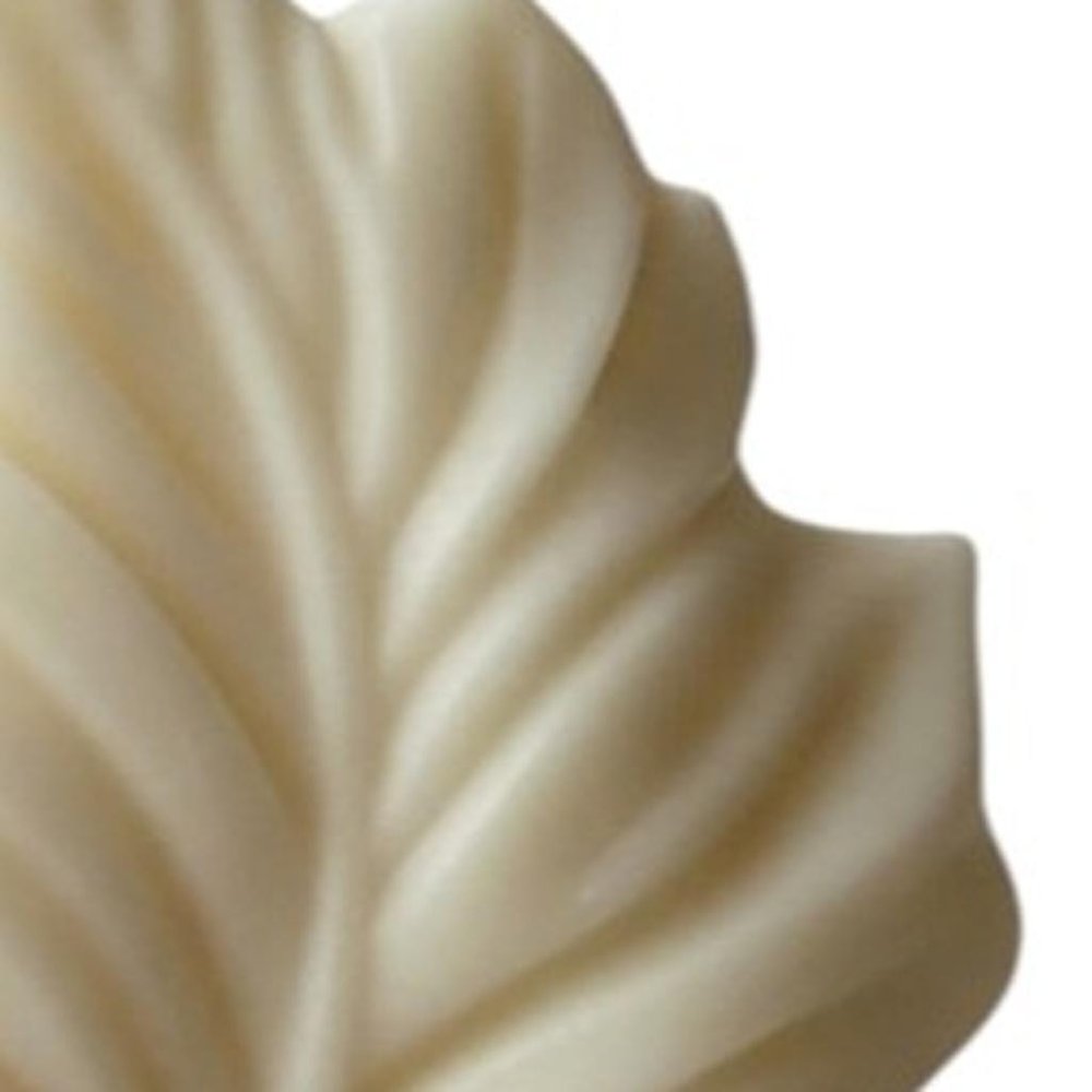 6" Ivory Unscented Dimensional Feather Candle Novelty Novelty. Candle in ivory.