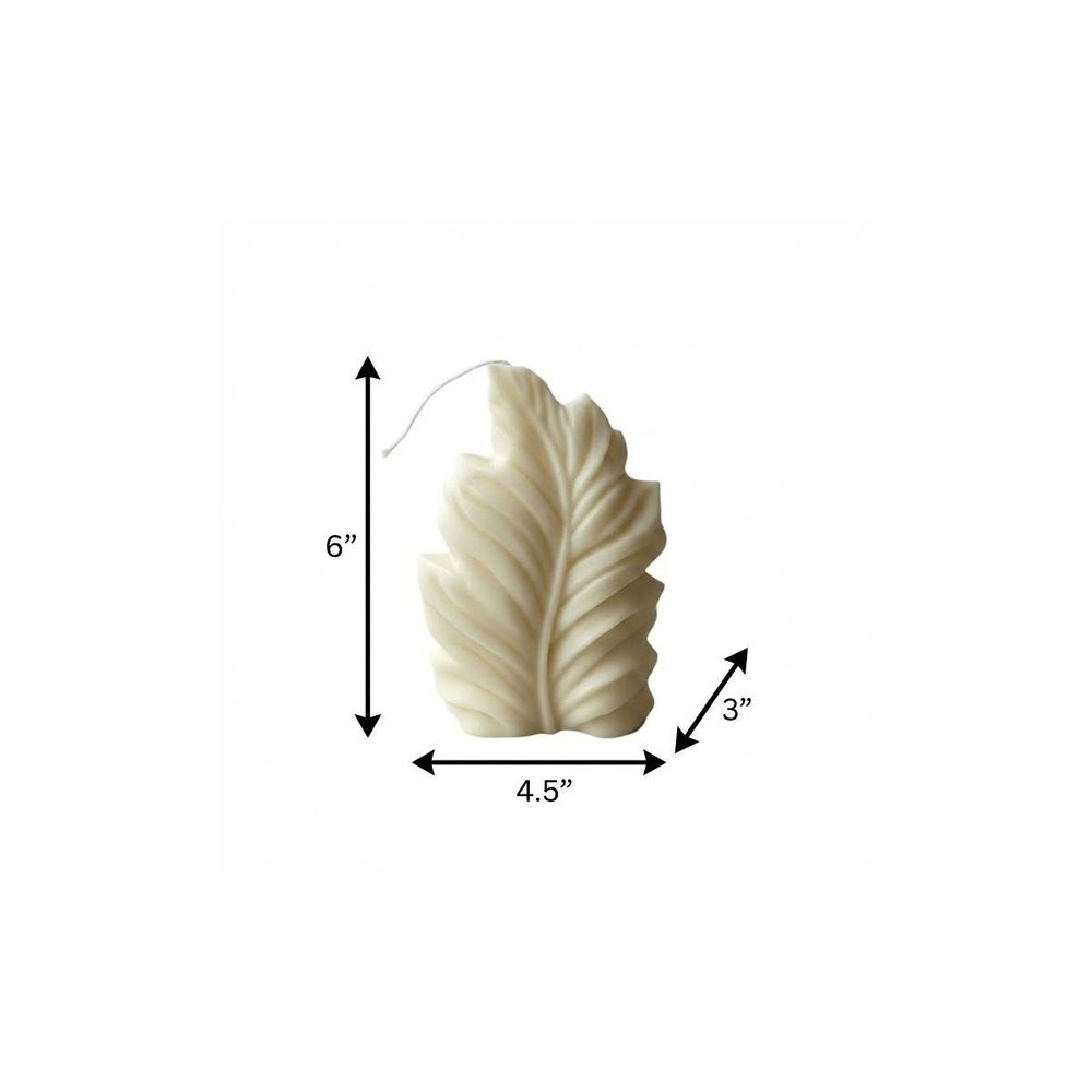 6" Ivory Rose Petals Scented Dimensional Feather Candle Novelty Novelty. Candle isolated on a plain white background, in a ivory finish.