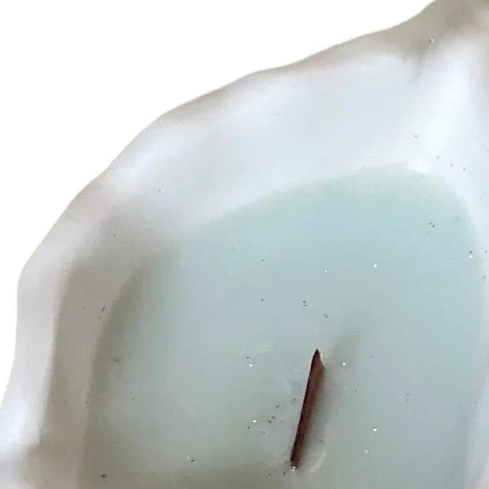 6" Light Blue High Tide Scented Soy Wax Candle In White Resin Novelty Holder. Candle in white resin.