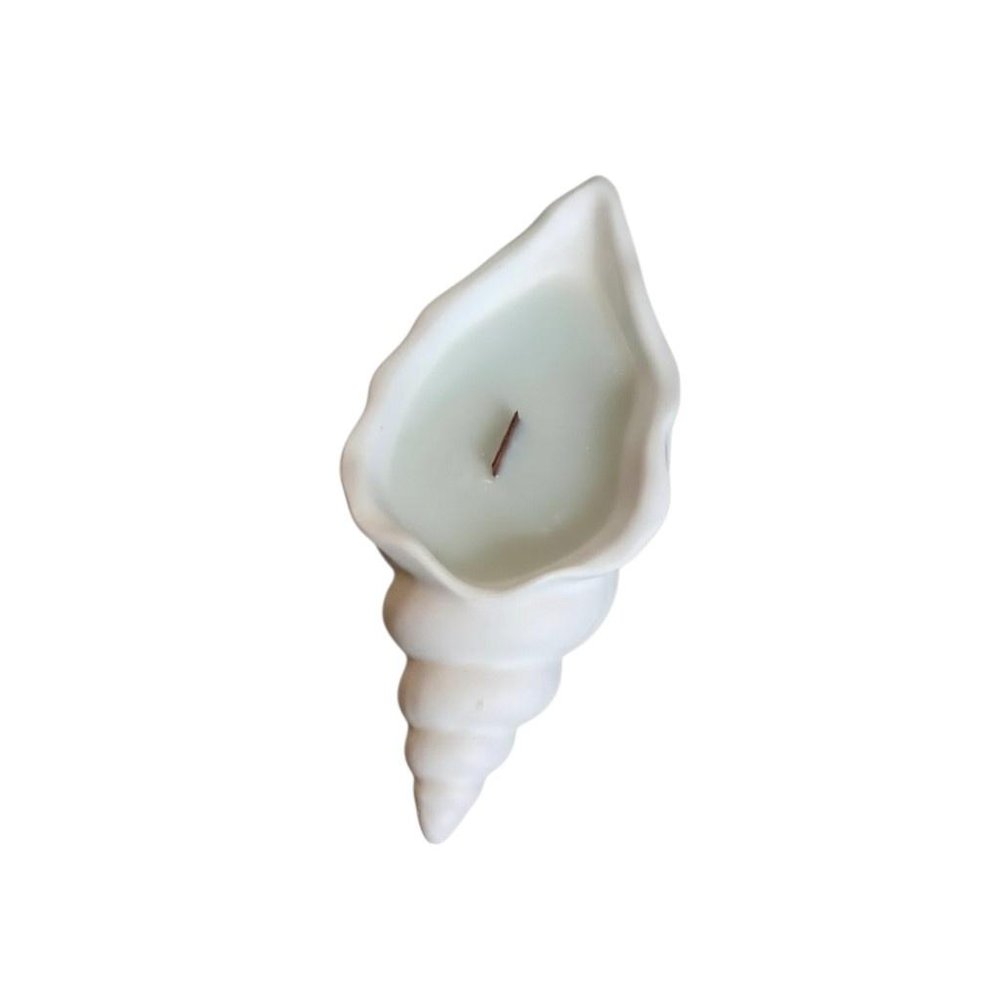 6" Light Blue Ocean Breeze Scented Soy Wax Candle In White Resin Novelty Holder. Candle isolated on a plain white background, in a white resin finish.