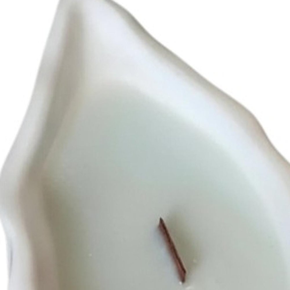 6" Light Blue Ocean Breeze Scented Soy Wax Candle In White Resin Novelty Holder. Candle isolated on a plain white background, finished in white resin.