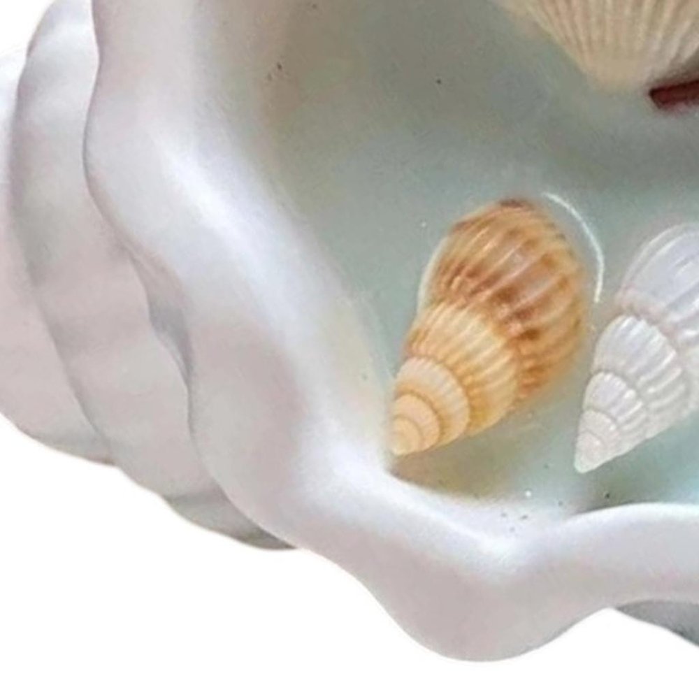 6" Light Blue Sea Salt And Orchid Scented Candle In White Resin Novelty Holder With Shells. Candle in white resin.