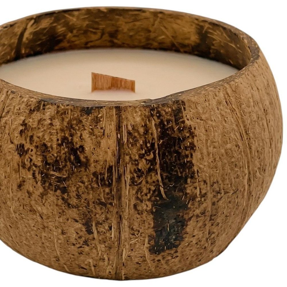 4" Ivory Unscented Candle In Brown Coconut Shell Holder. Candle isolated on a plain white background, finished in brown.