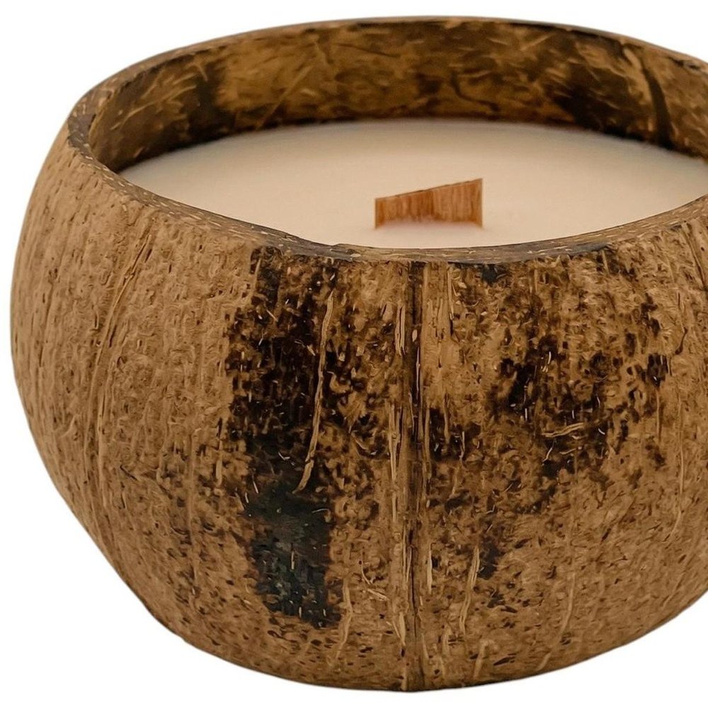 4" Ivory Unscented Candle In Brown Coconut Shell Holder. Candle isolated on a plain white background, showing its brown color.